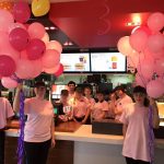 Mudgee Maccas employees in pink holding pink ballons