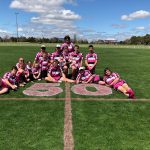 Young rugby club wearing pink uniforms